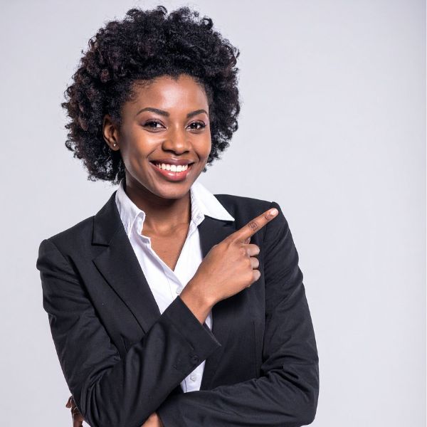 A woman smiling while pointing right